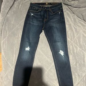 The high waist ankle skinny blue jeans with some rips